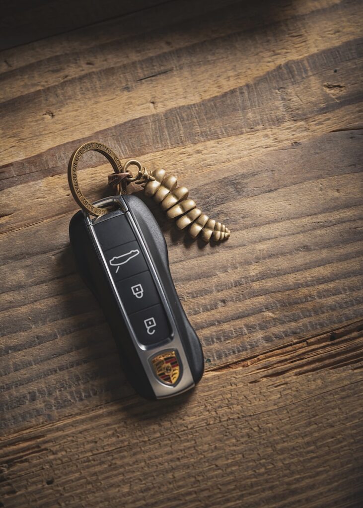 a car keychain with a key chain attached to it