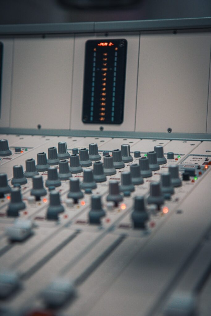 A close up of a sound mixing console