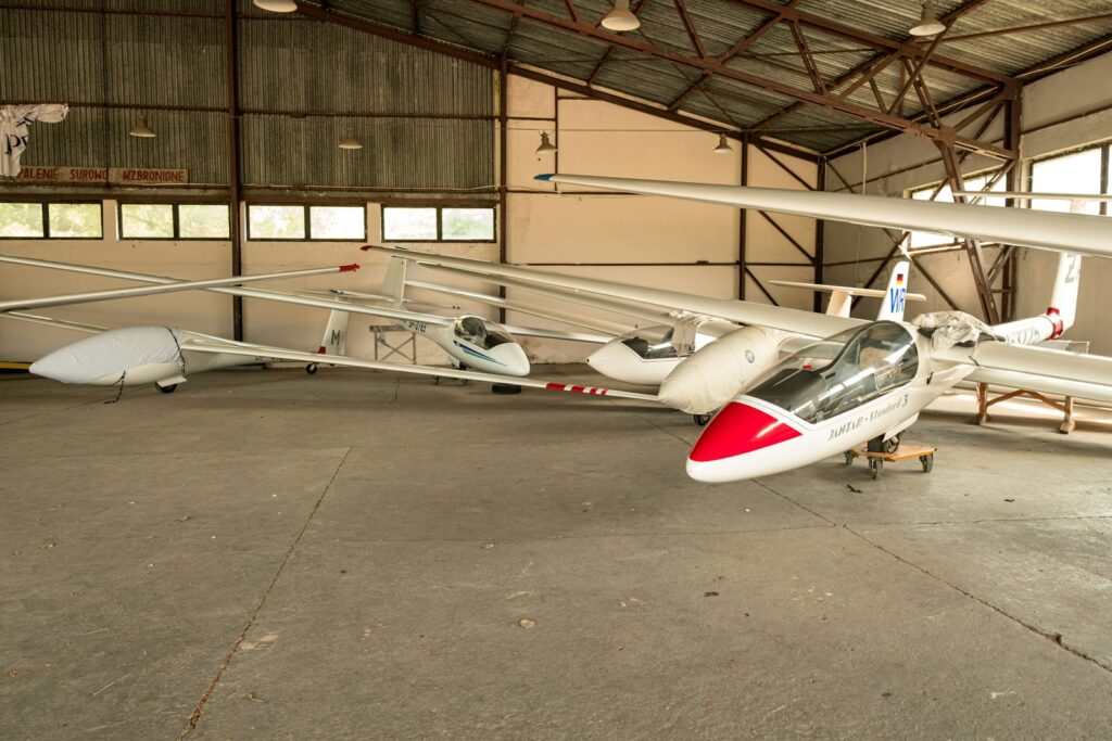 a couple of airplanes in a hangar