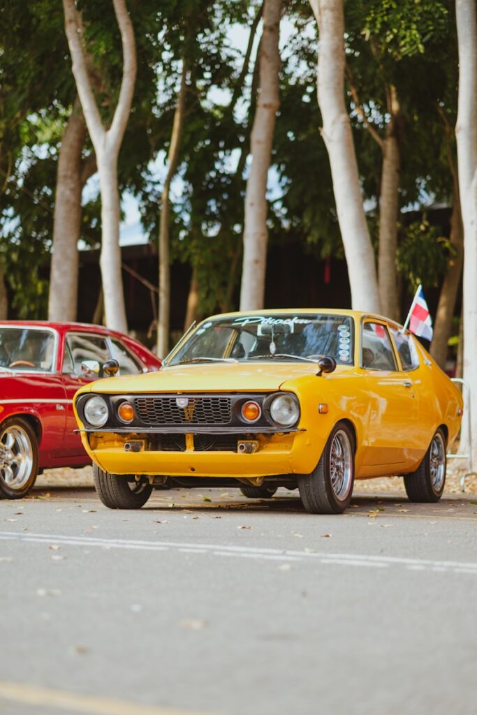 A couple of cars parked next to each other on a street