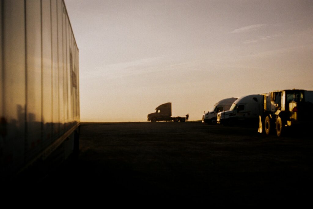 white van parked beside white building during daytime