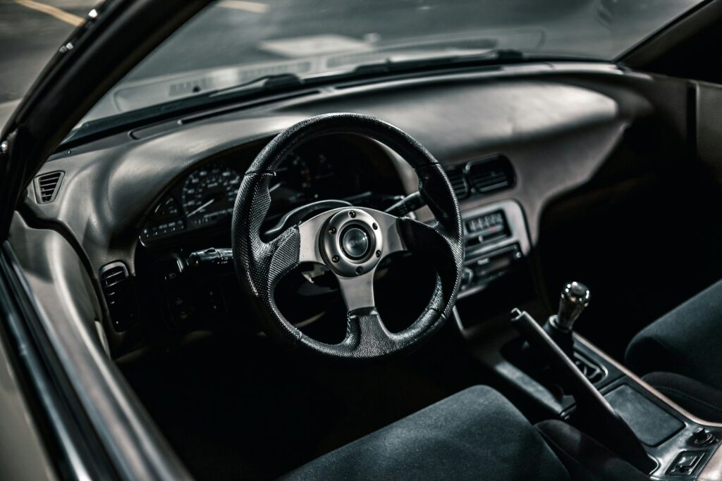 black and silver steering wheel