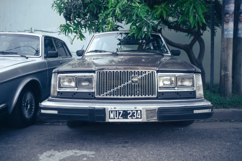 a car parked next to another car in a parking lot