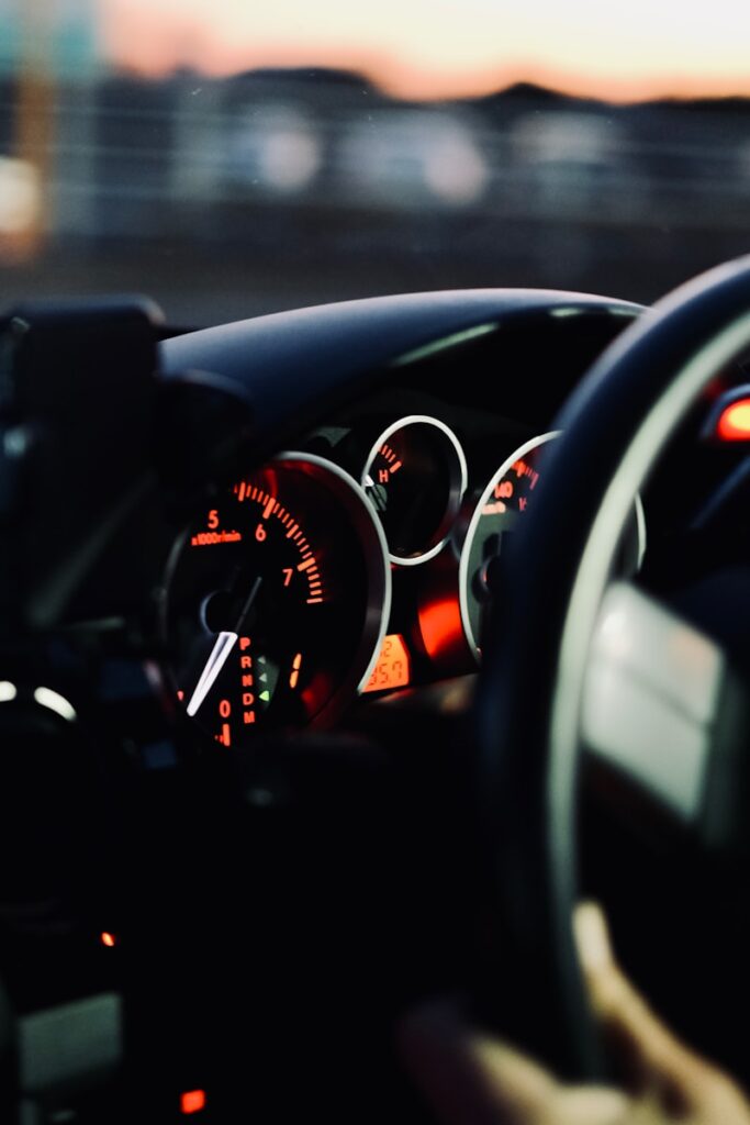 the dashboard of a car with a dash light on