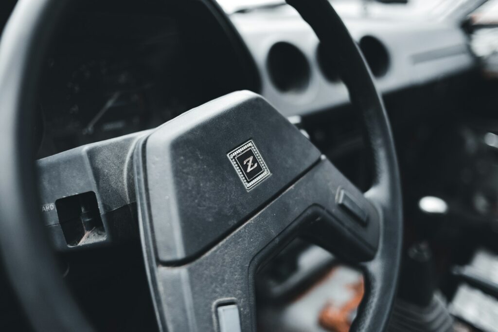 a close up of a steering wheel of a car