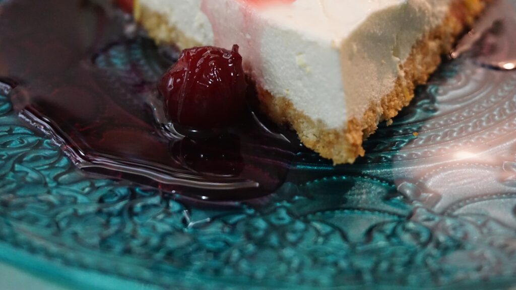white and brown cake on clear glass plate