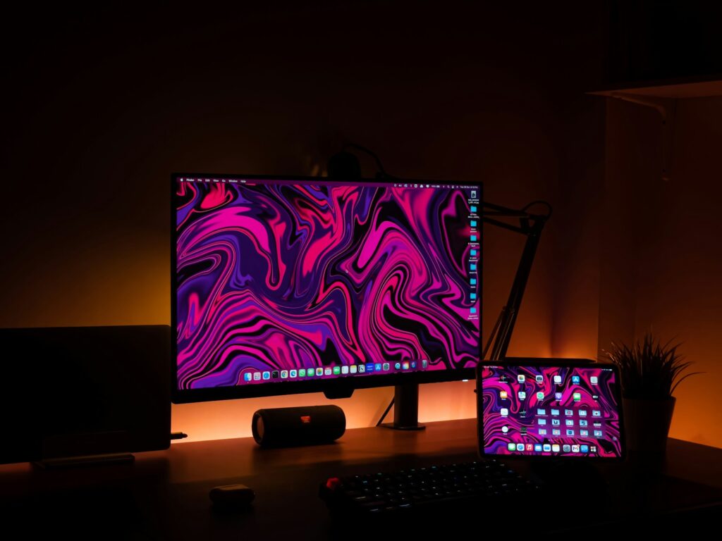 a desktop computer sitting on top of a wooden desk