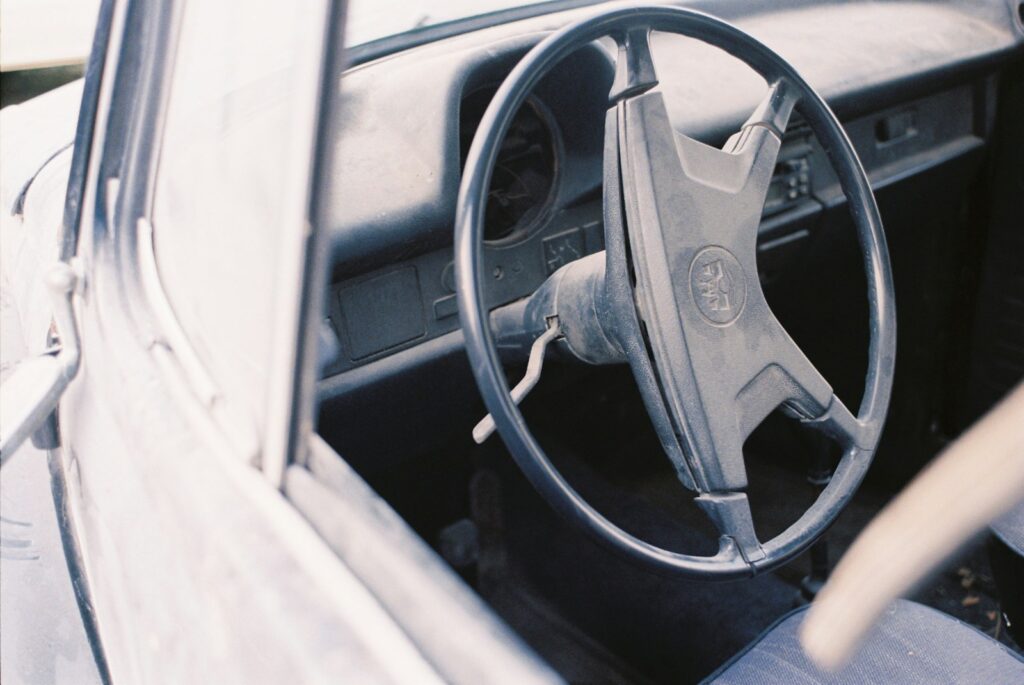 the interior of a car with a steering wheel