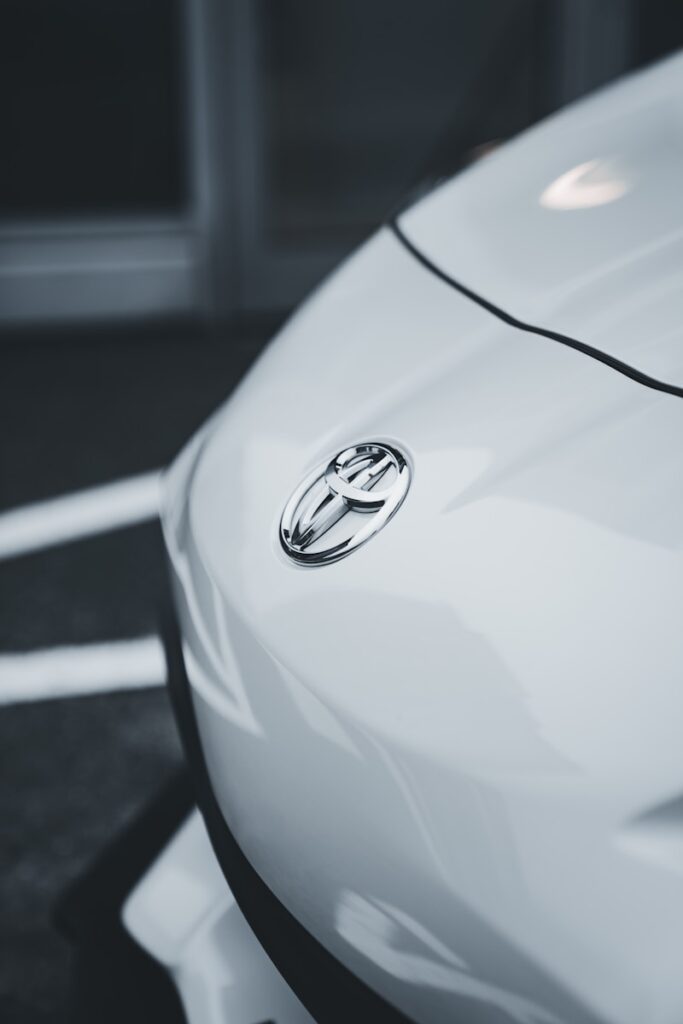 a close up of the emblem on a white car