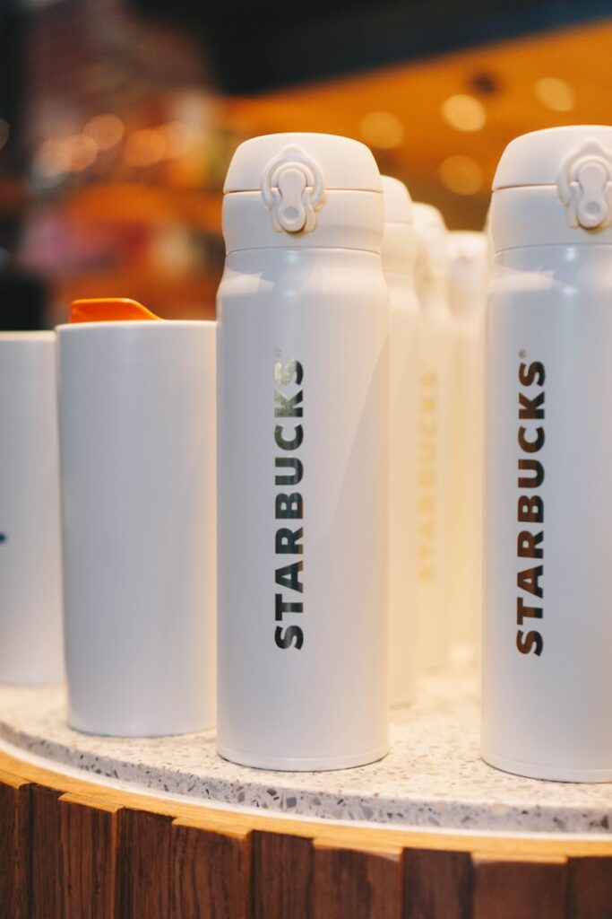 white and black ceramic mugs