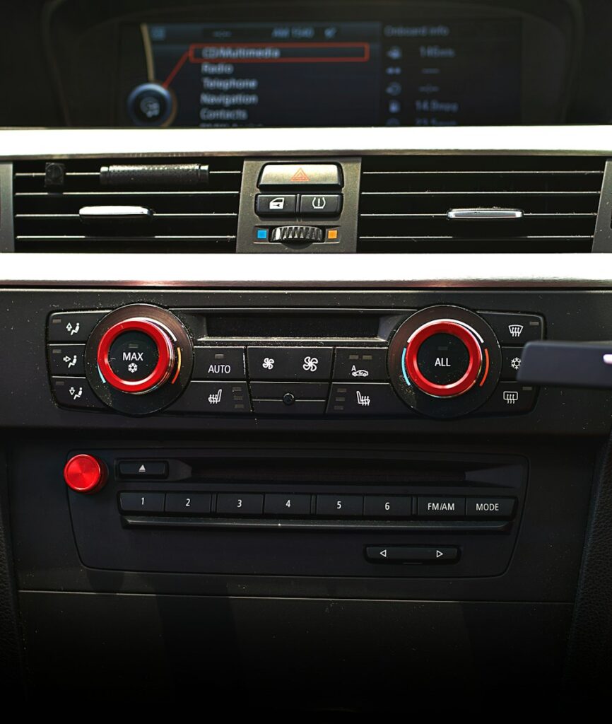 Car's dashboard with various controls displayed.