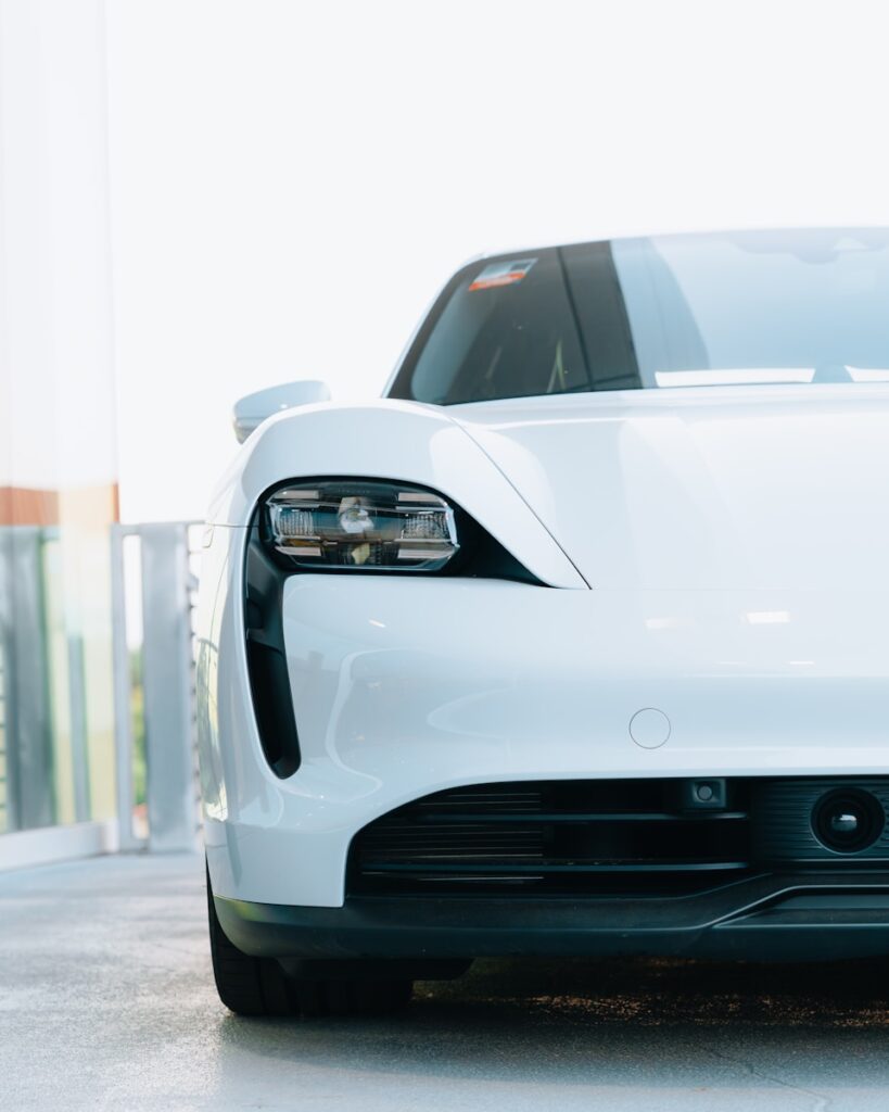 a white sports car parked in a garage