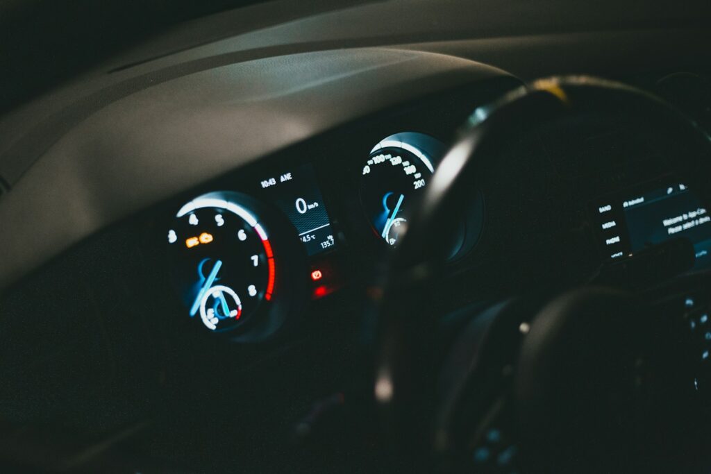 the dashboard of a car with a speedometer and gauges