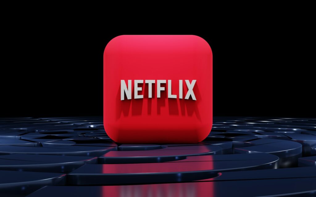 a red netflix box sitting on top of a black floor