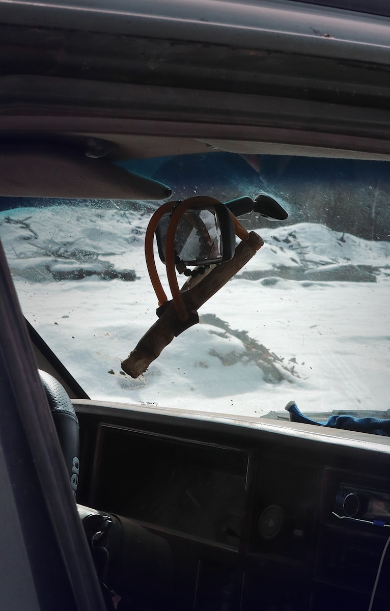 a car with a steering wheel in the snow