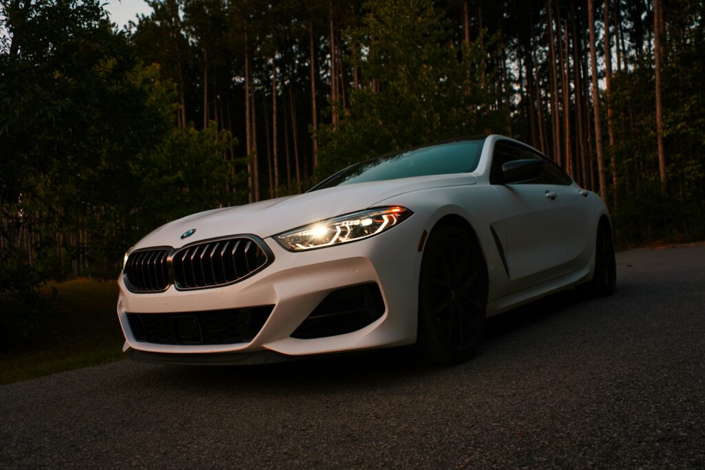 silver bmw m 3 coupe parked on gray asphalt road during daytime