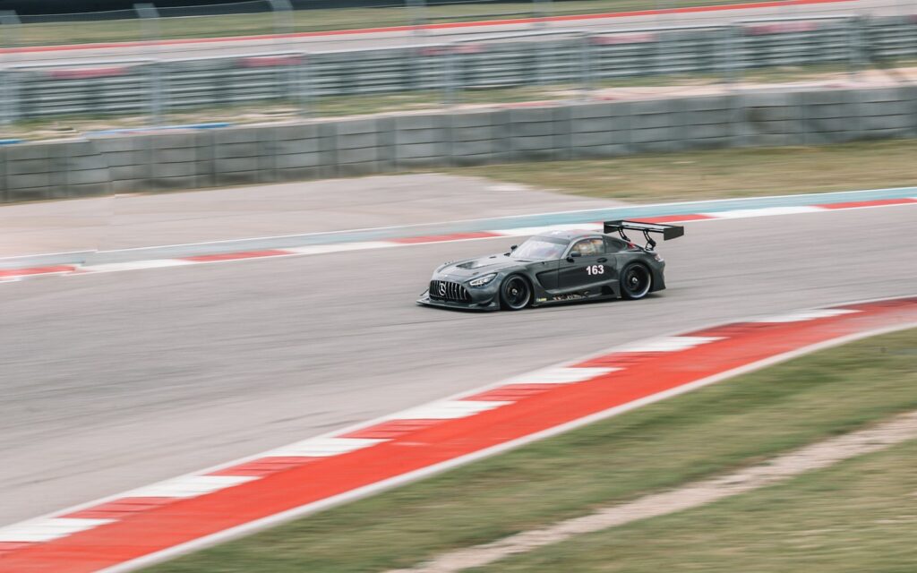 black and white racing car on track during daytime