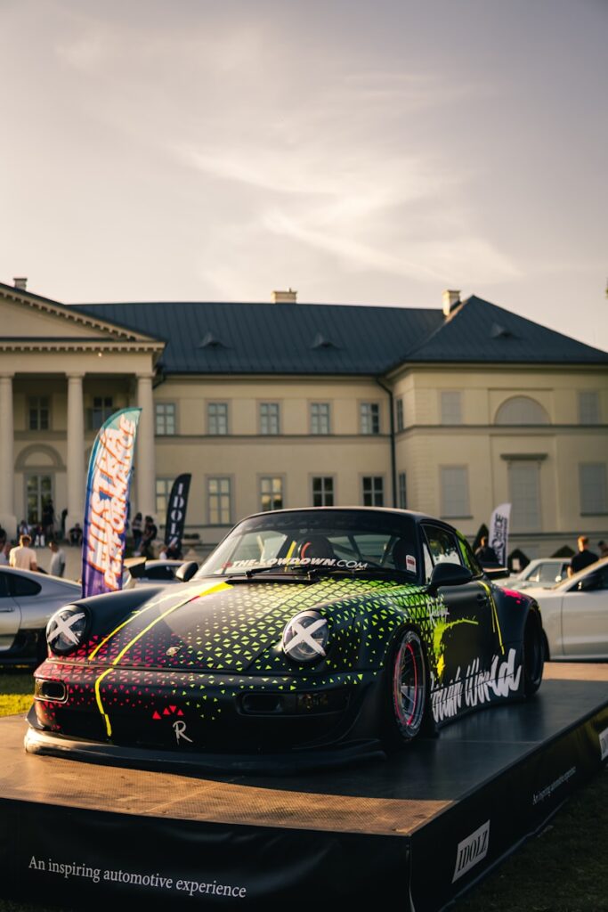 Customized black porsche on display at event