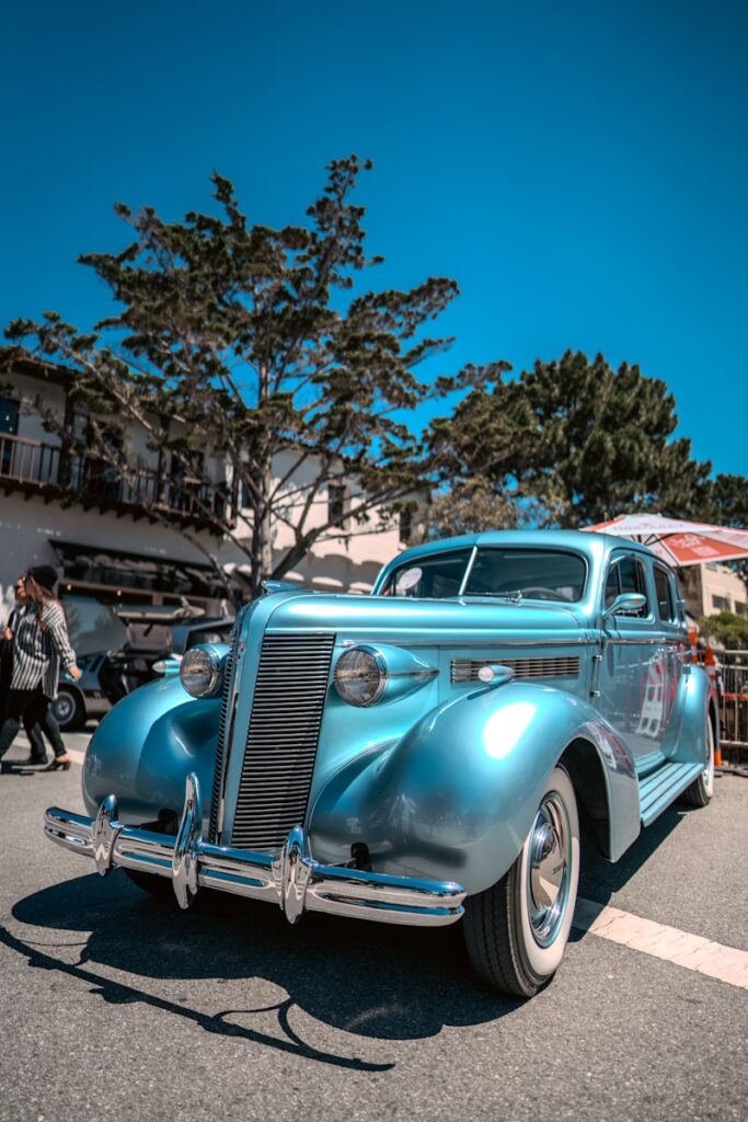 A blue car parked on the side of the road