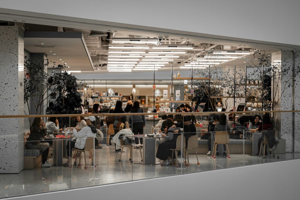 A group of people sitting at tables in a room