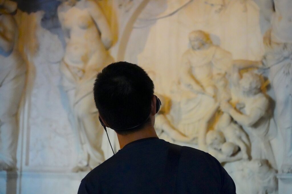 a person looking at a painting