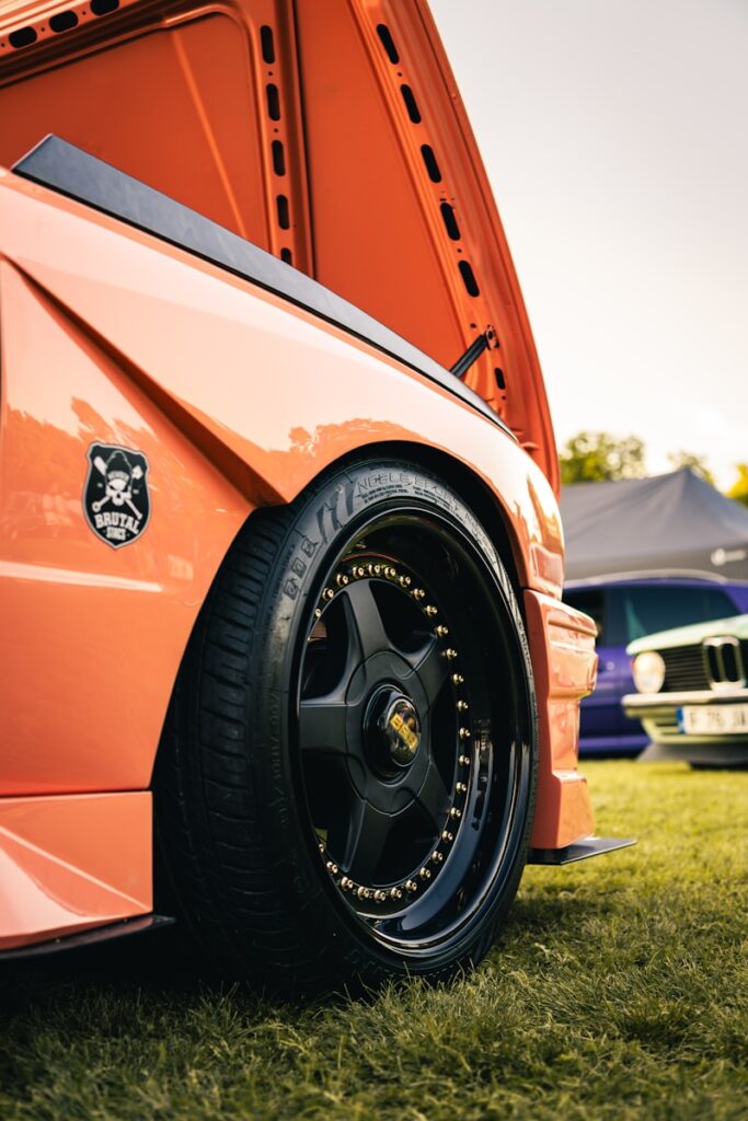 Orange car with custom black wheel