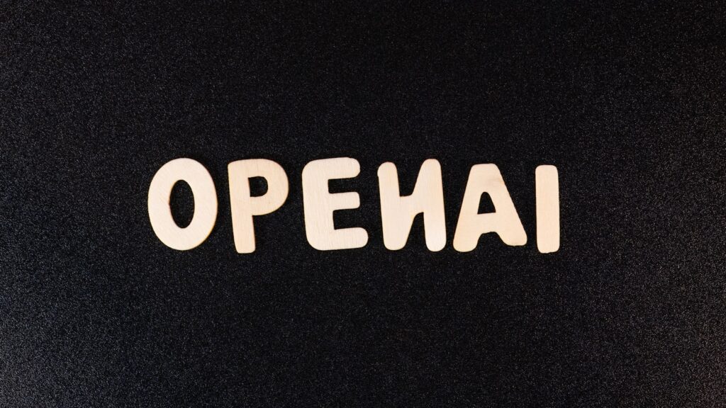 a close up of a black surface with white letters