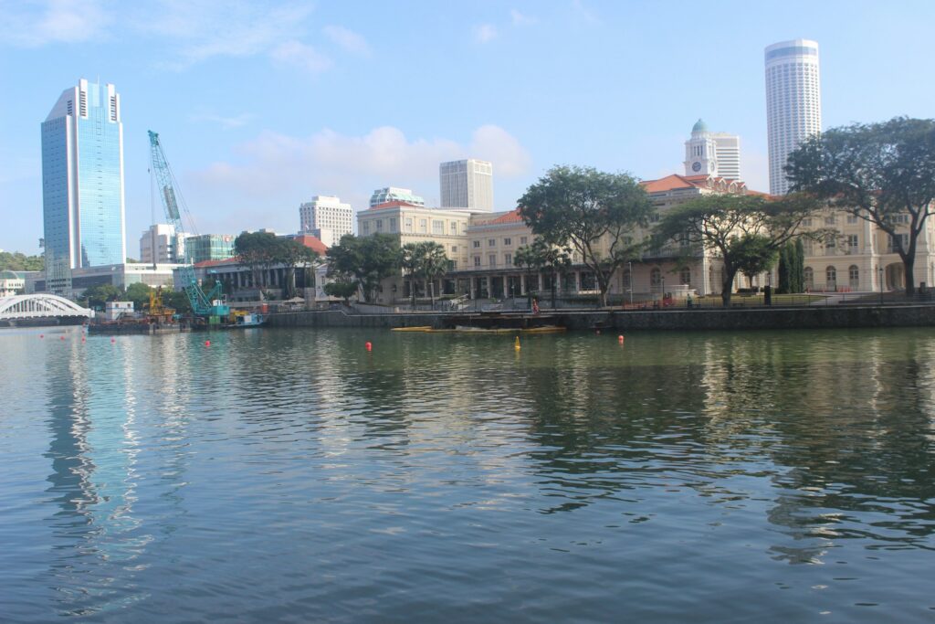 a body of water with buildings in the background
