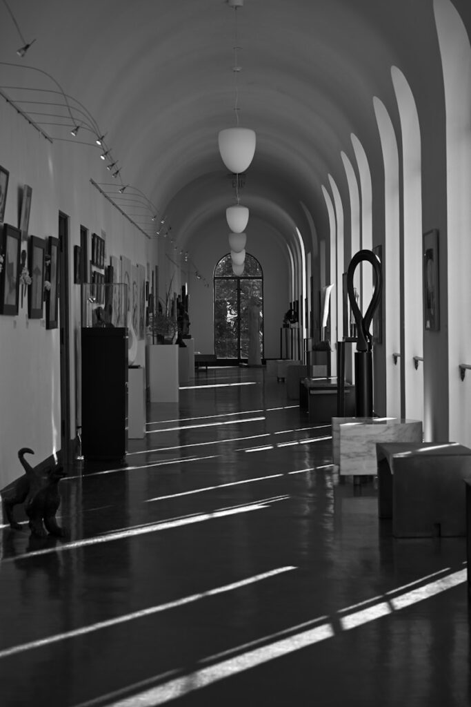 A black and white photo of a hallway