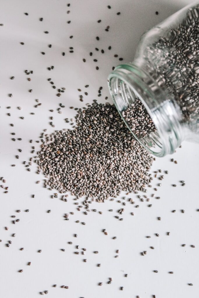 black beads in clear glass jar