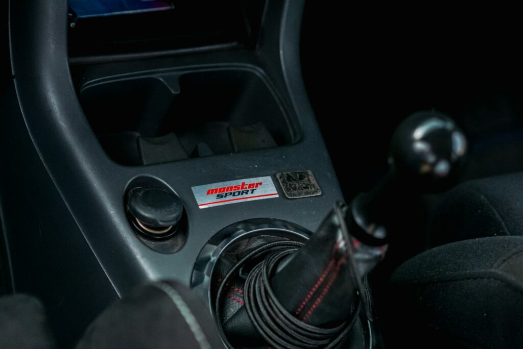 a car steering wheel and dashboard