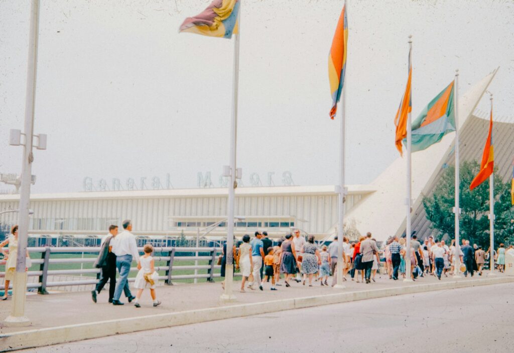 People queue outside the general motors pavilion.