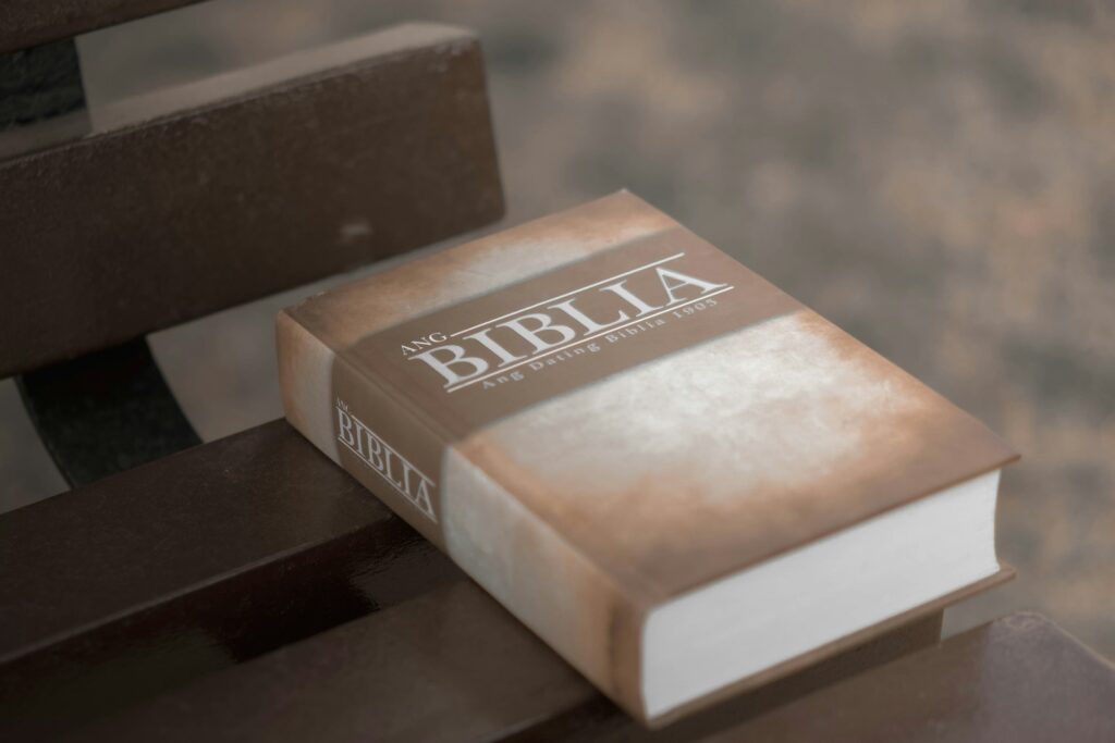 a book sitting on top of a wooden bench