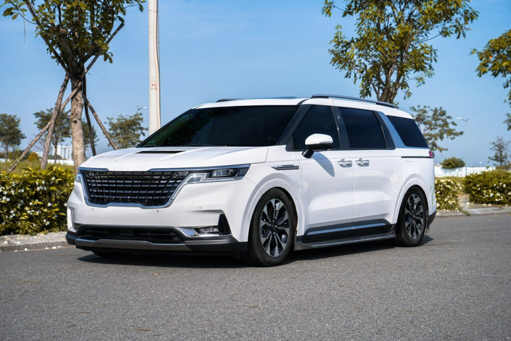 a white suv parked on the side of a road
