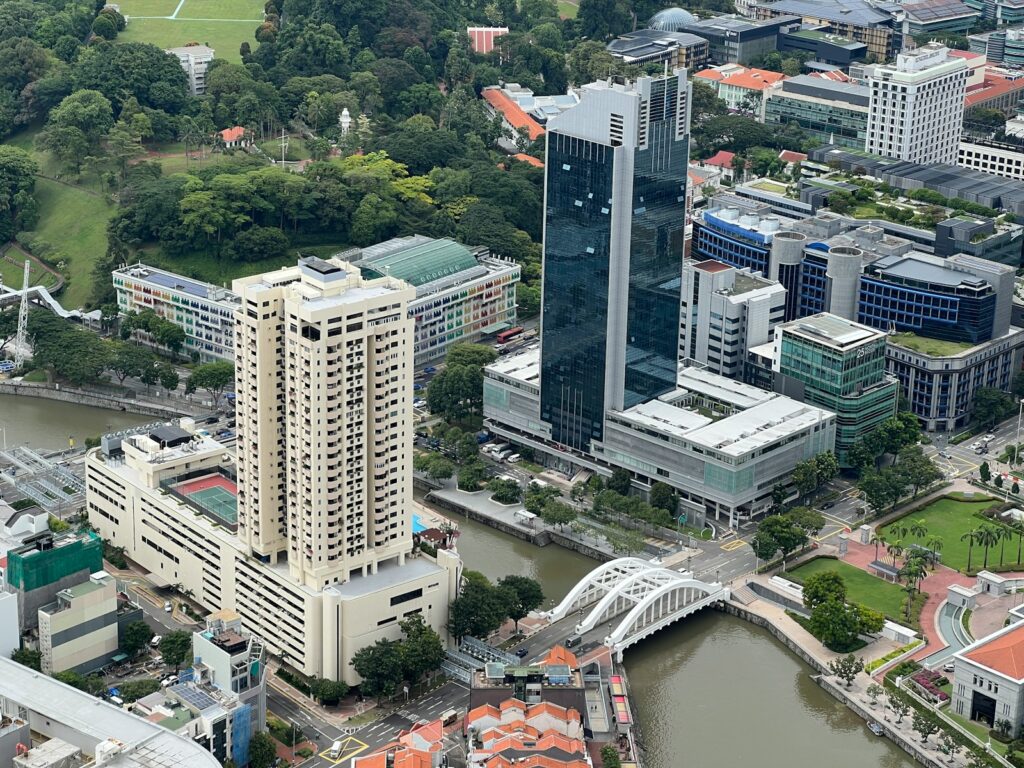 a river with buildings and trees