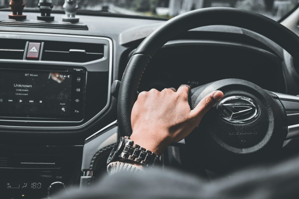 person driving car during daytime