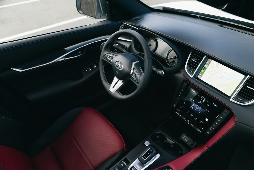 Modern car interior with leather seats and dashboard.