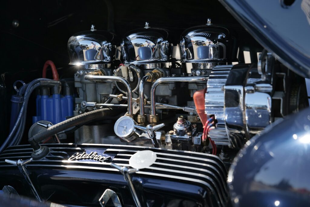 a car engine with people in the background