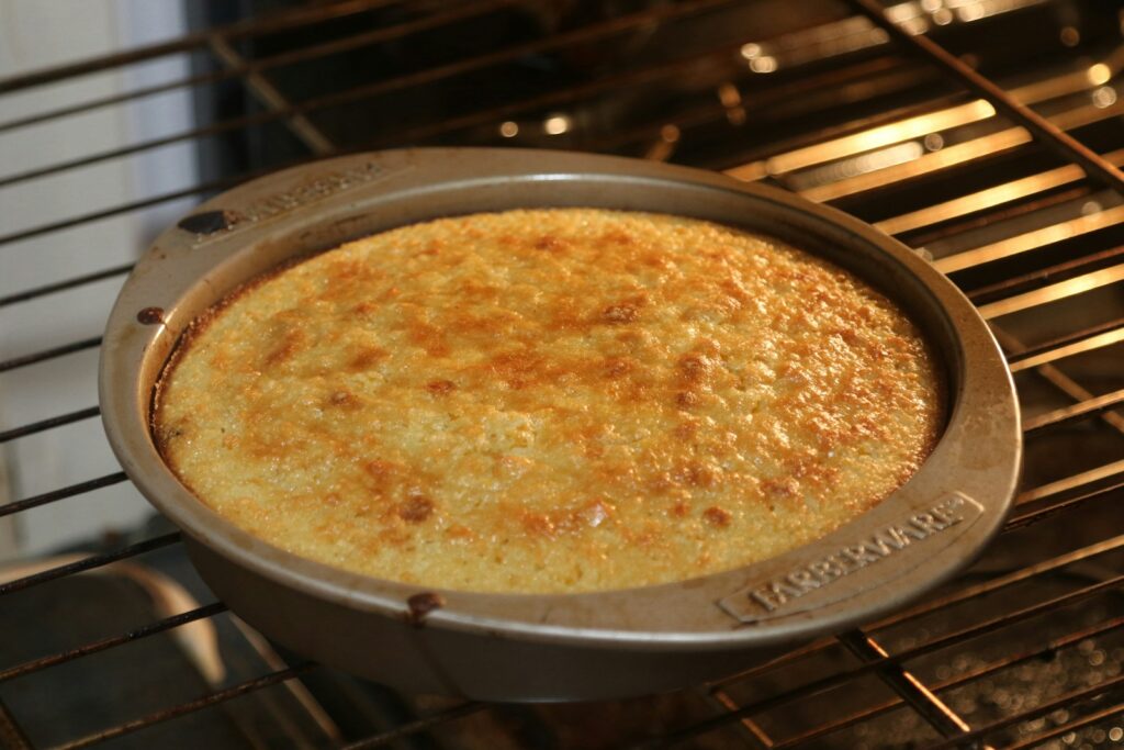 A pan of food cooking in an oven