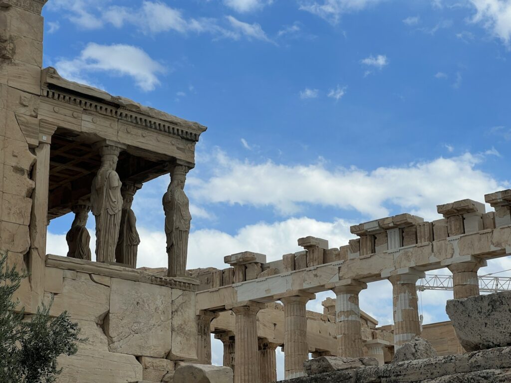 a building with columns and statues