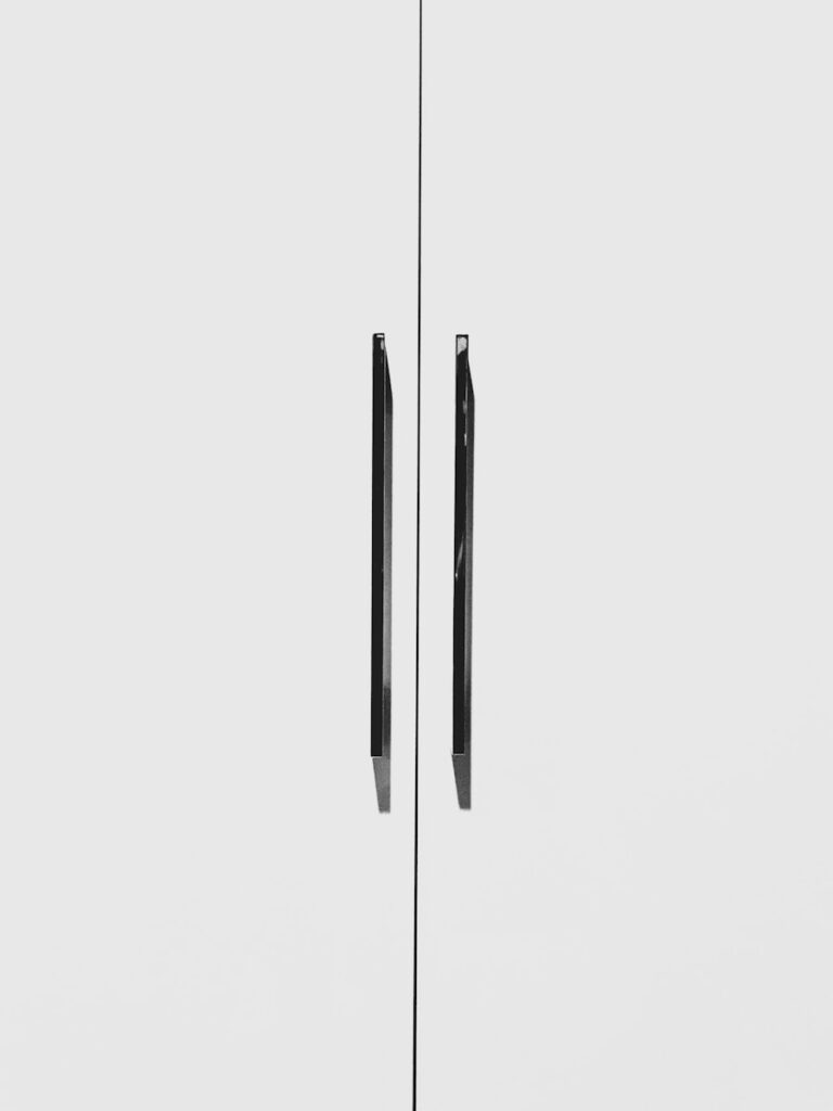 black and gray pin on white surface