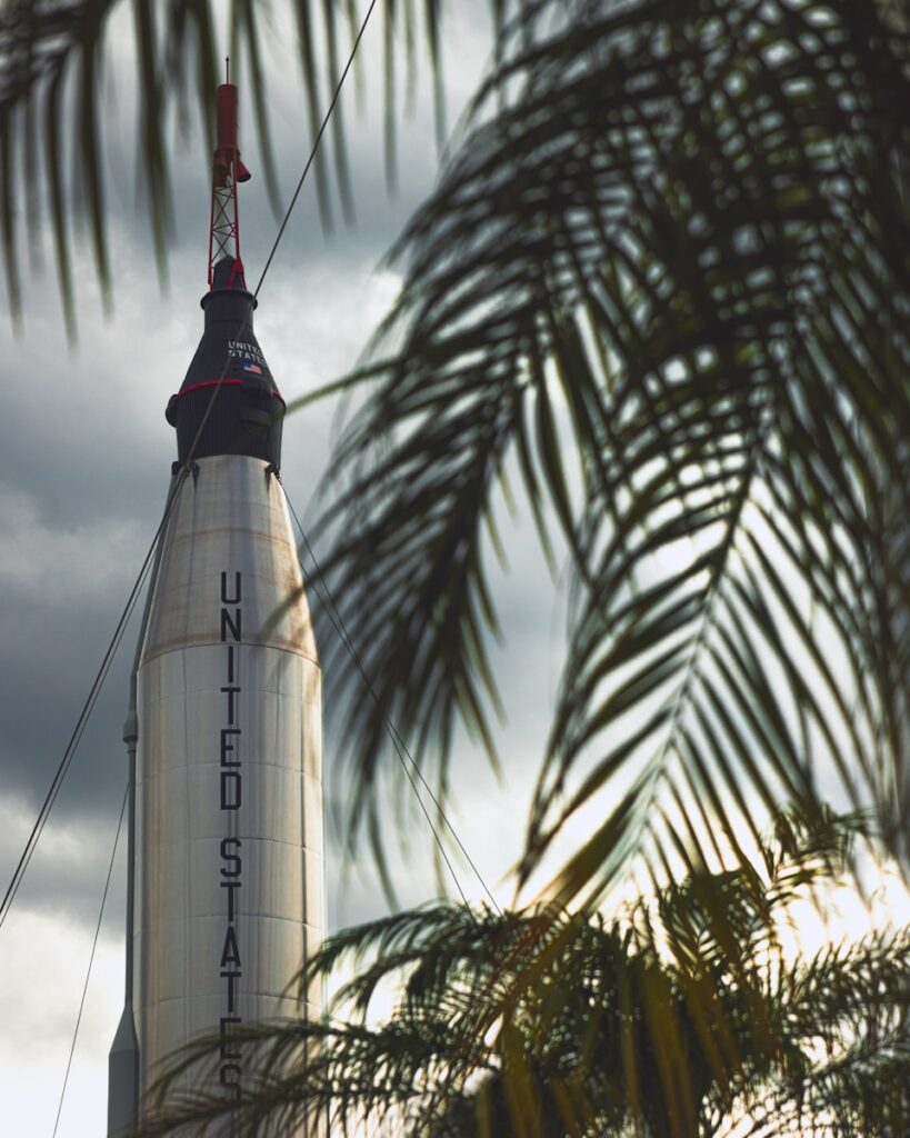 a large white rocket sitting on top of a building
