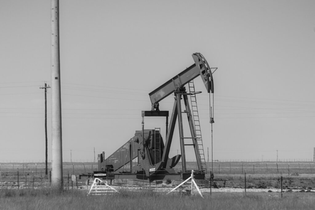 A black and white photo of an oil pump